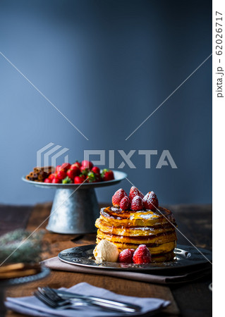 Strawberry pancakes with maple syrup Strawberry pancakes with maple syrup 62026717