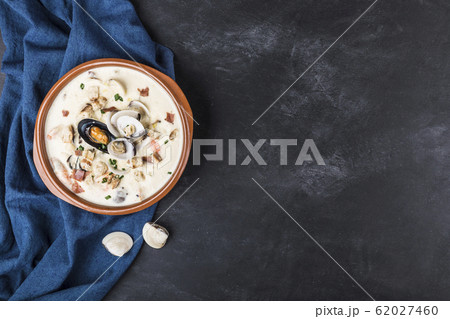 Clam chowder in a brown plate. The main 62027460