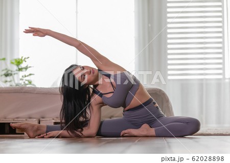 Asian woman practice yoga to meditation in bedroom 62028898