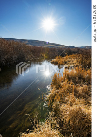River by autumn trees 62032680