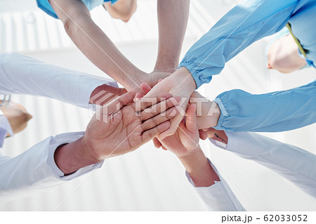 Medical workers stacking hands 62033052