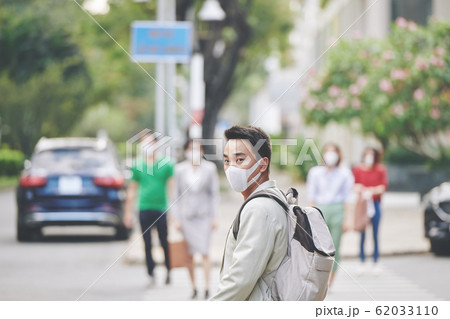 Town citizen in protective mask 62033110