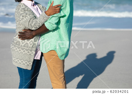 Old couple in love at the beach Old couple in love at the beach 62034201