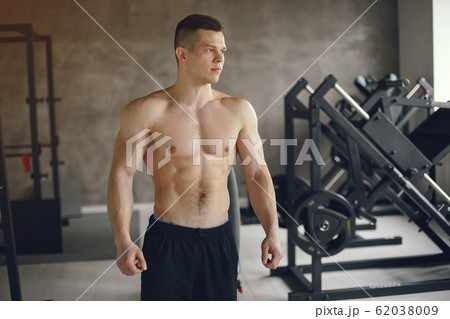 A handsome man is engaged in a gym 62038009