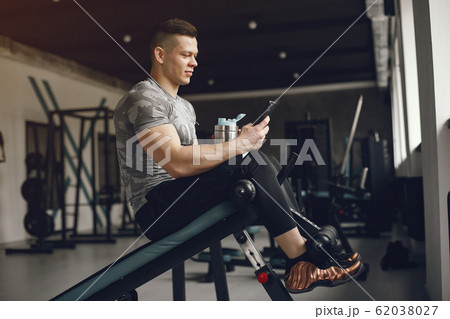A handsome man is engaged in a gym 62038027