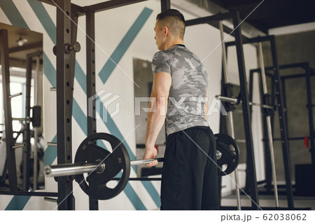 A handsome man is engaged in a gym 62038062