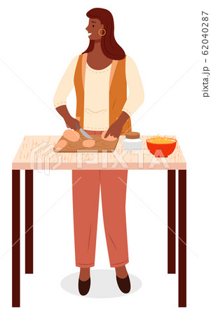 Woman Cut Potatoes, Cooking on Table in Kitchen 62040287