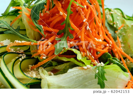 Macro photo of salad with cucumber, spicy carrot 62042153