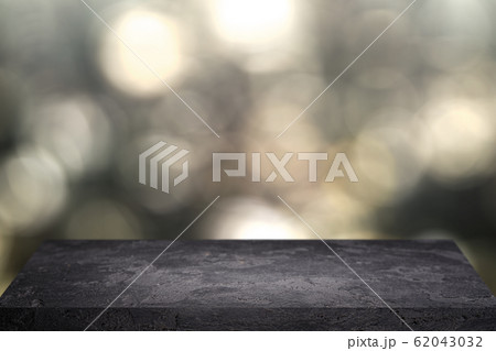Stone surface on black background of blurry spots. 62043032