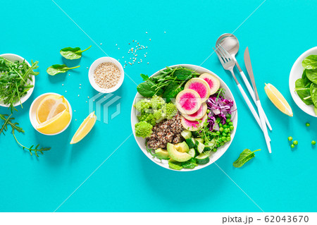 Vegan lunch bowl with quinoa, cucumber, green 62043670