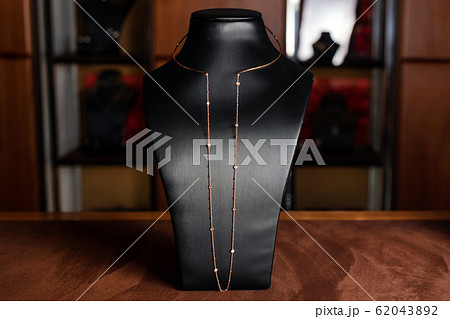 Necklace made of gold with diamonds on a stand in Necklace made of gold with diamonds on a stand in 62043892