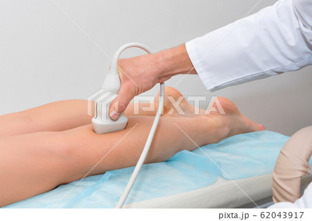 Doctor in white uniform with diagnostic equipment Doctor in white uniform with diagnostic equipment 62043917