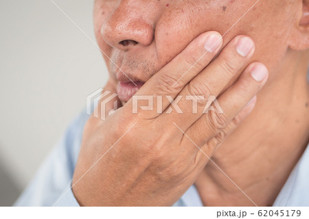 sick old senior man with toothache, dental care sick old senior man with toothache, dental care 62045179