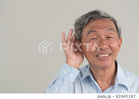 senior old man listening to good news 62045197