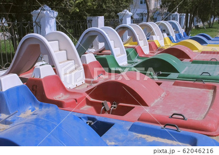 Colored catamarans on the waterfront near the sea. 62046216