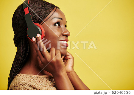 Black Woman Enjoying Music 62046556