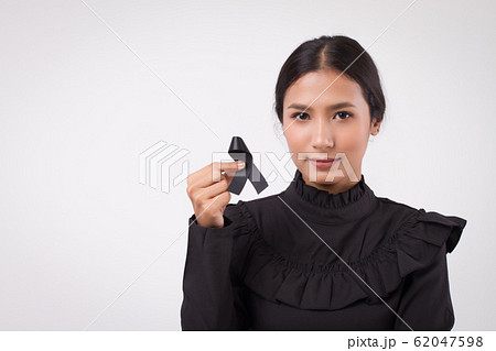 sad woman hand holding black ribbon bow, sad sad woman hand holding black ribbon bow, sad 62047598