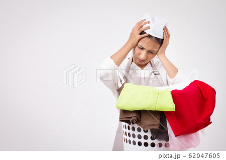 unhappy girl, frustrated woman with laundry basket unhappy girl, frustrated woman with laundry basket 62047605