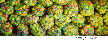 Sacks of fresh bell pepper. Eco-friendly products. Agriculture and farming. Harvest. Harvesting. Freshly harvested. Selective focus Sacks of fresh bell pepper. Eco-friendly products. Agriculture and farming. Harvest. Harvesting. Freshly harvested. Selective focus 62048652