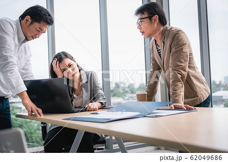 Businesspeople Teamwork are Seriously During Meeting Together 62049686