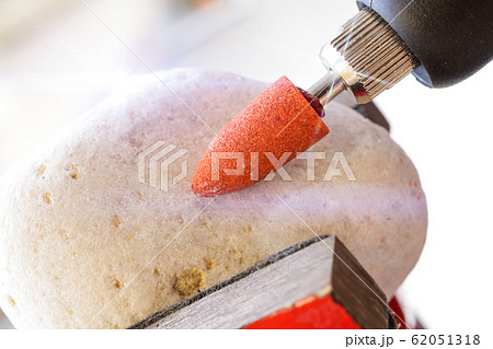 Sanding rock with rotary multi tool 62051318