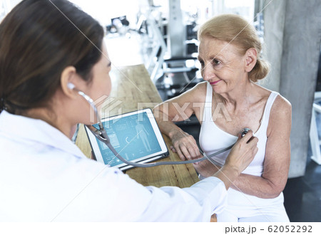 Doctor with senior woman in rehabilitation center Doctor with senior woman in rehabilitation center 62052292