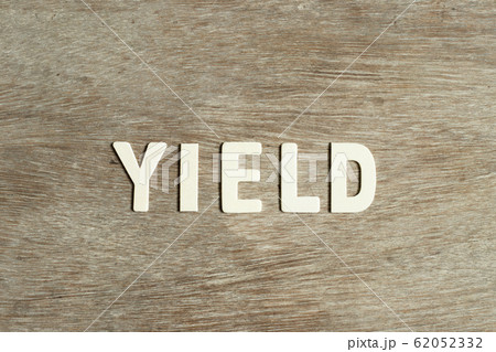 Alphabet letter in word yield on wood background 62052332