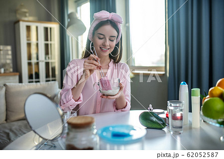 Young pretty girl in a pink headband having a beauty day 62052587