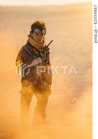 Post Apocalyptic Boy Outdoors in a Wasteland 62054667