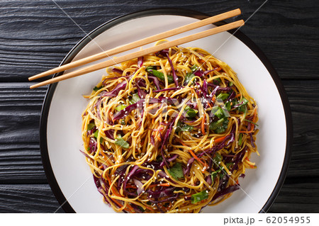 Tasty egg noodles with vegetables and sesame seeds 62054955