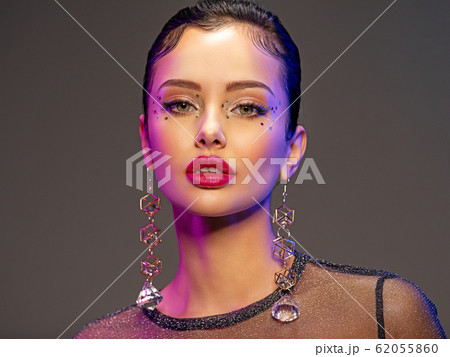 Portrait of beautiful young woman with bright 62055860