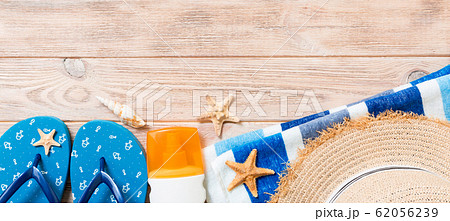 flip flops, straw hat, starfish, sunscreen bottle, 62056239