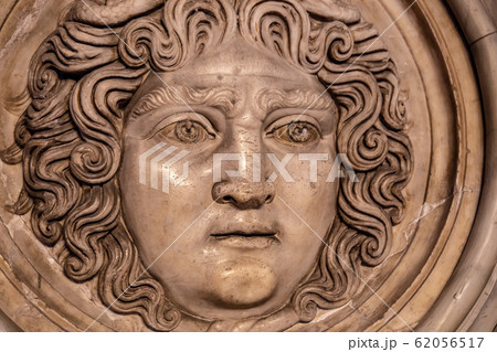 Medusa face sculpture. Head portrait of MedusaIn Greek mythology Medusa was a monster, a Gorgon, a winged human female with a hideous face and living venomous snakes in place of hair 62056517