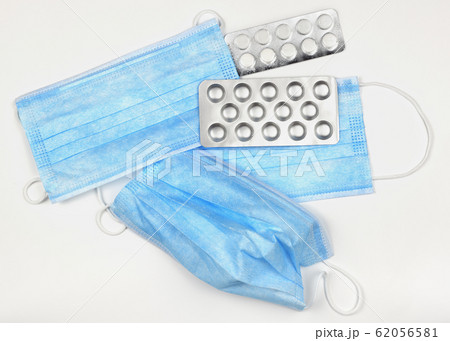 Blue medical mask and pills Blue medical mask and pills 62056581