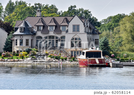 Building in a grassy area on the coast of a lake Building in a grassy area on the coast of a lake 62058114