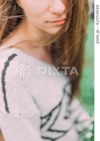 beautiful woman with flowers walking through the green forest in early spring beautiful woman with flowers walking through the green forest in early spring 62058680