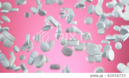 Freeze motion of flying pills on pink background Freeze motion of flying pills on pink background 62058733