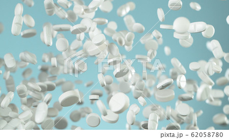Freeze motion of flying pills on blue background Freeze motion of flying pills on blue background 62058780