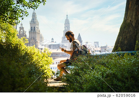 Young Man On Pilgrimage At Santiago De Compostela With Phone 62059016