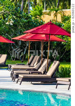 Beautiful umbrella and chair around outdoor swimming pool in hotel resort for holiday vacation travel 62060122