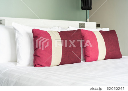 Beautiful comfortable pillow and blanket on bed decoration 62060265