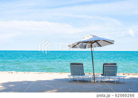 Beautiful umbrella and chair around beach sea ocean with blue sky for travel 62060266