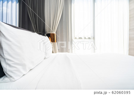 White pillow on bed decoration interior 62060395