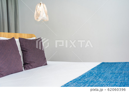 White pillow on bed decoration interior 62060396