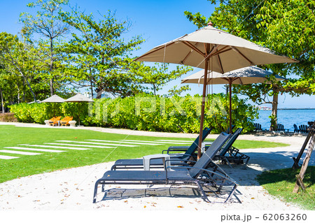 Umbrella and chair on the beach and sea with blue sky 62063260