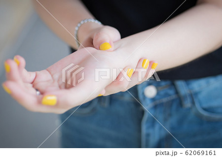 sick woman with trigger finger pain; portrait of sick woman with trigger finger pain; portrait of 62069161
