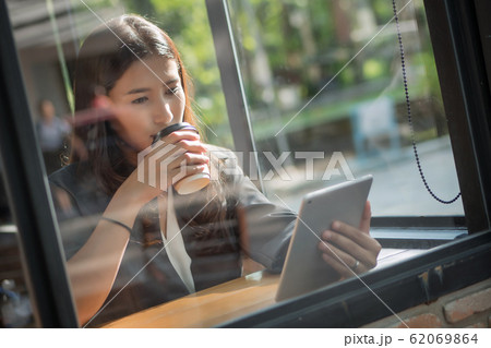 business woman using computer tablet; portrait of 62069864
