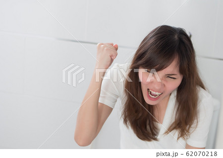 angry woman in toilet by diarrhea, constipation, 62070218