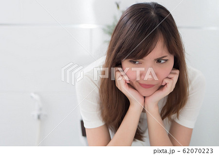 upset woman in toilet by diarrhea, constipation, upset woman in toilet by diarrhea, constipation, 62070223