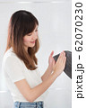 clean woman hand wash; portrait of asian woman 62070230